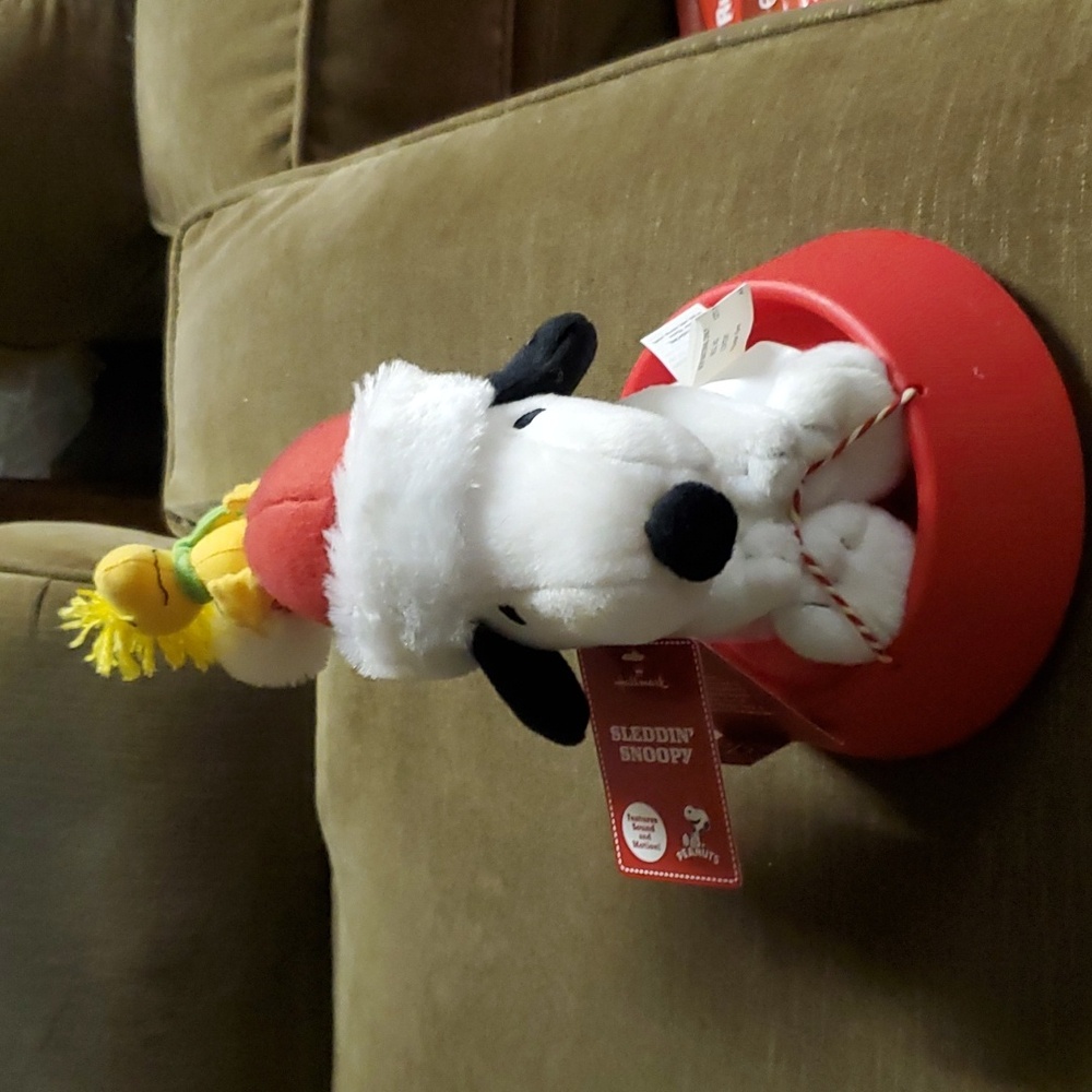 Hallmark sledding Snoopy with Woodstock.